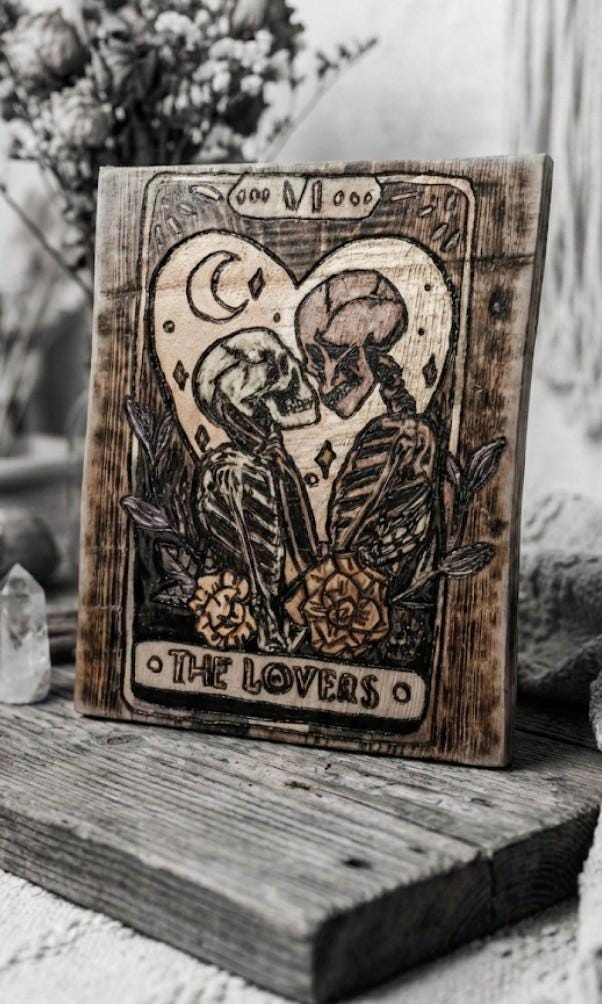 Hand-woodburned tarot cards crafted from sinker cypress, showcasing a customized bayou Gothic design.